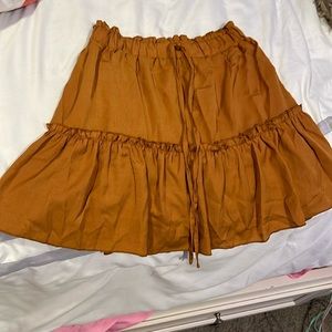 Brands new brown juniors skirt. Copper closet.